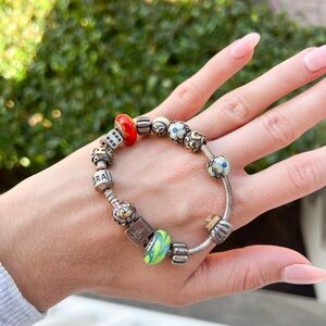 Pandora bracelet with charms purse flower dice bible cupcake green red orange
